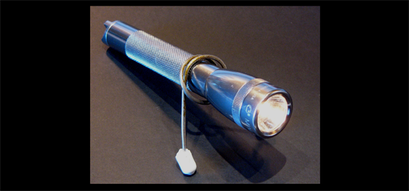 A MiniMag flashlight set up for paranormal exploration. (staff photo)